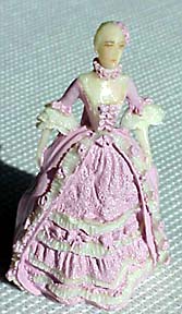 Lady of 1755 in a ruffled lavendar gown.