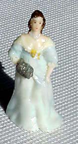 A lady of 1630 in pale blue gown with muff.