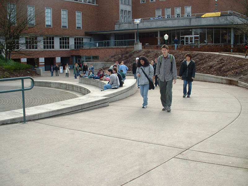 EMU at UO, long sloped sidewalks up and down into the building