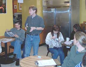 Professor Schlossberg conducting the data gathering training at a local coffee shop.